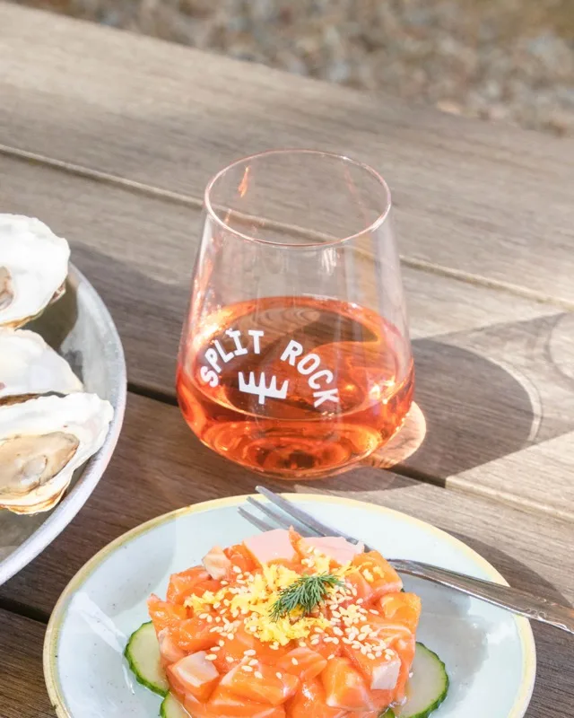 Glass of rosé and salmon tartare on the picnic table